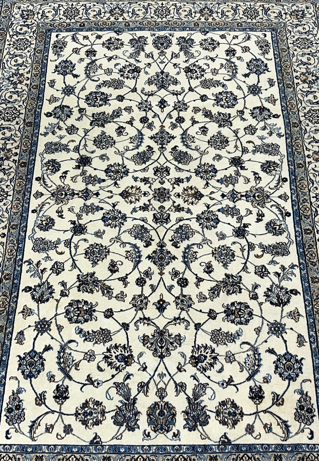 Close view of allover floral field on Persian Nain wool and silk rug