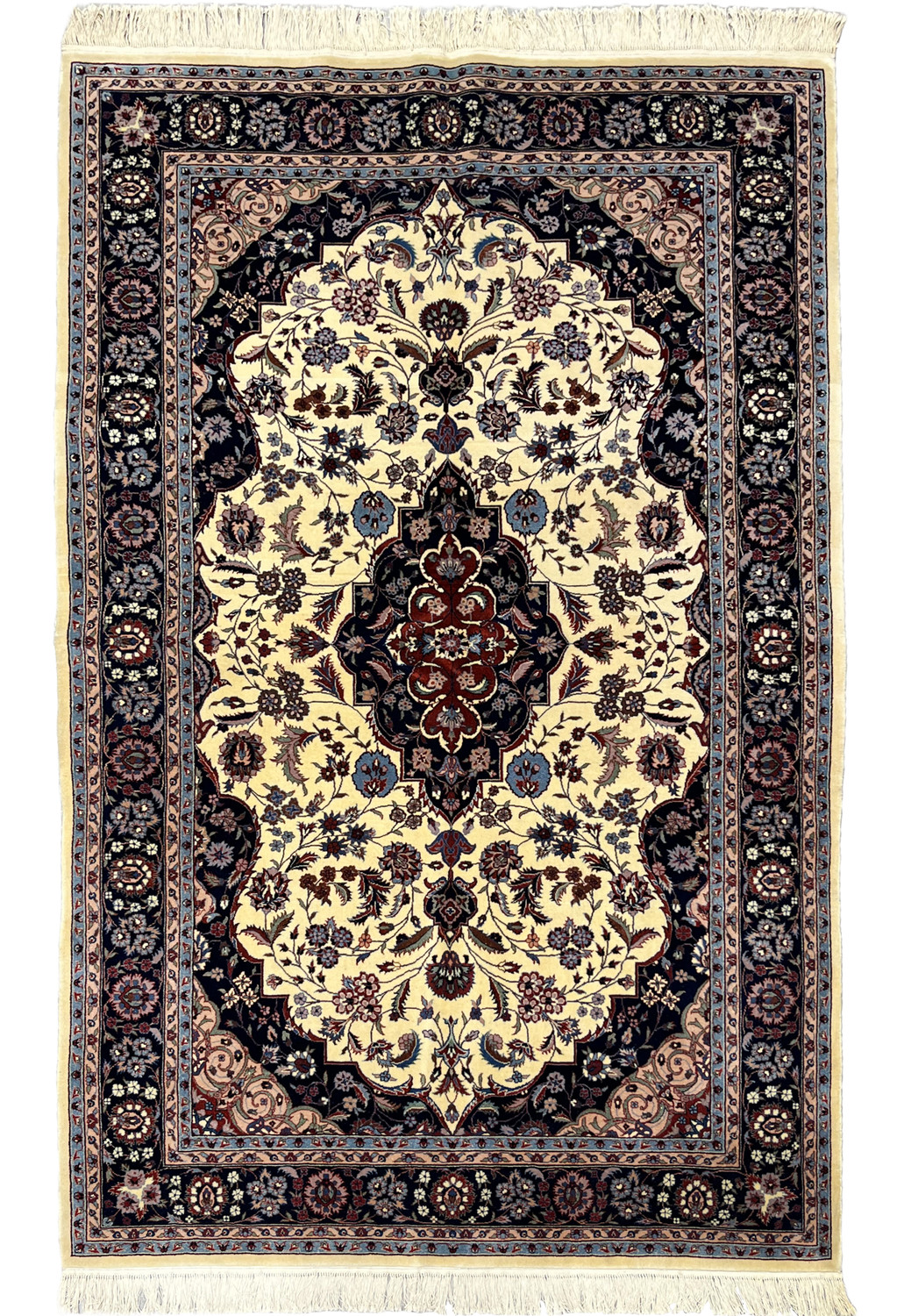Full view of Persian Tabriz rug highlighting ivory background and symmetrical medallion design