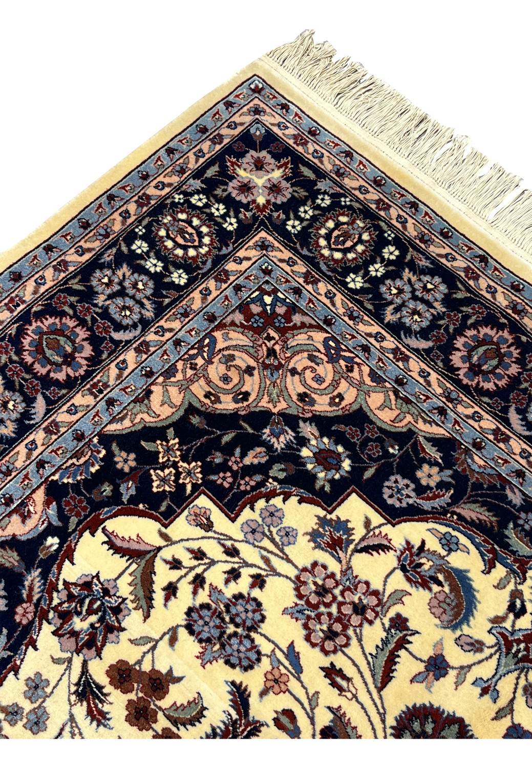 Upper edge of Persian Tabriz rug showing intact fringe and crisp border alignment
