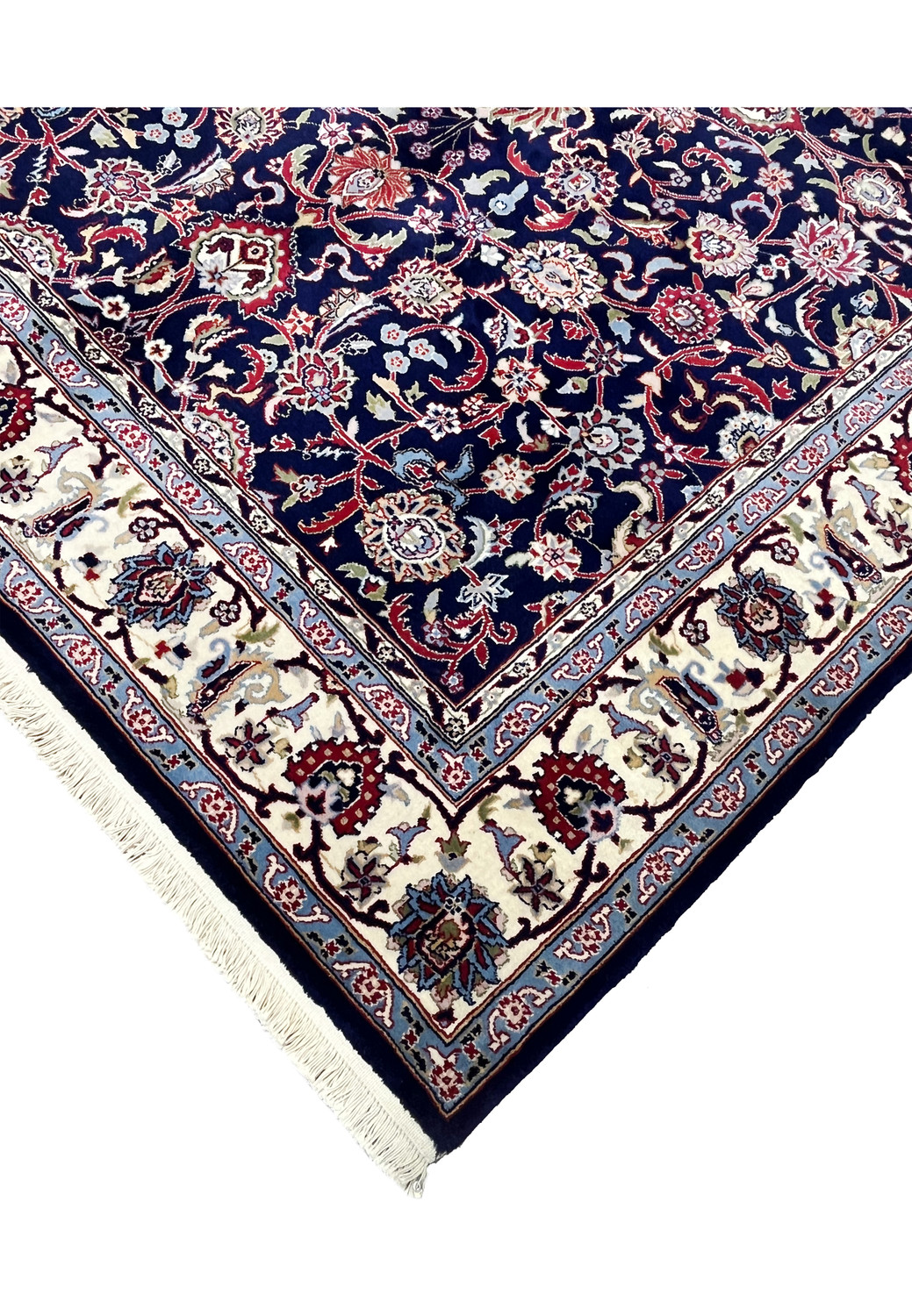 Side edge detail of a navy blue Persian Sarough kork rug highlighting tight knot structure, clean binding, and fine wool craftsmanship