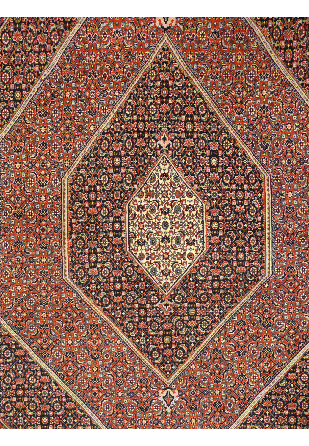 Close up of central geometric medallion in Bijar Persian iron rug with ivory highlights and dark navy outlines