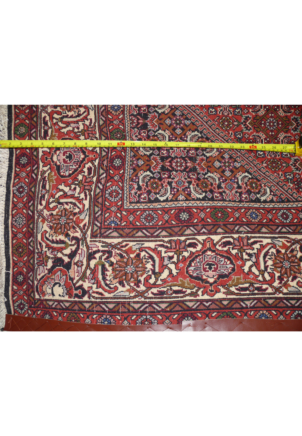 Backside of Persian Bijar iron rug revealing tight knot structure and heavy wool foundation