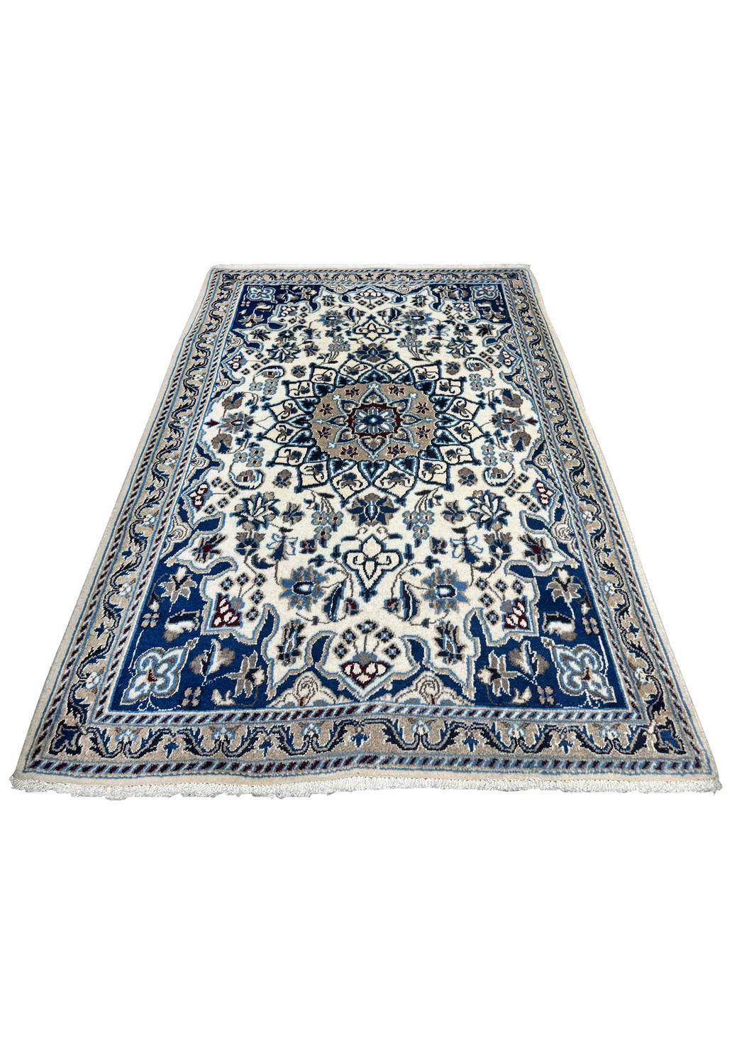 Top view of Persian Nain rug showing ivory field, blue medallion, and symmetrical floral layout