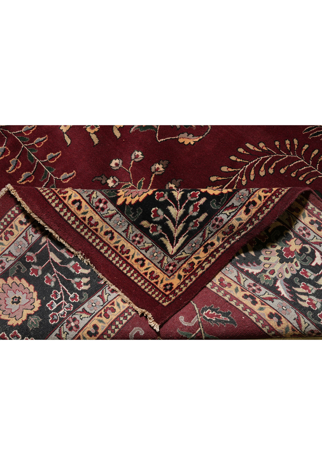 Folded edge showing wool pile thickness of large Sarough rug