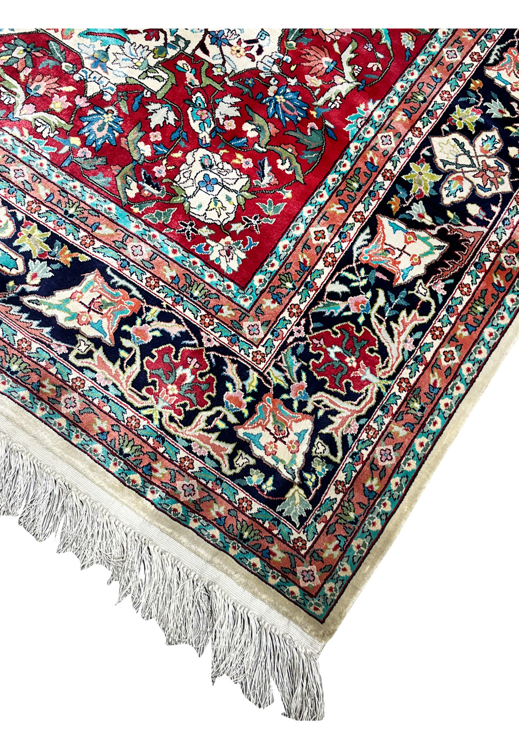 Edge and fringe detail of hand knotted silk oriental rug