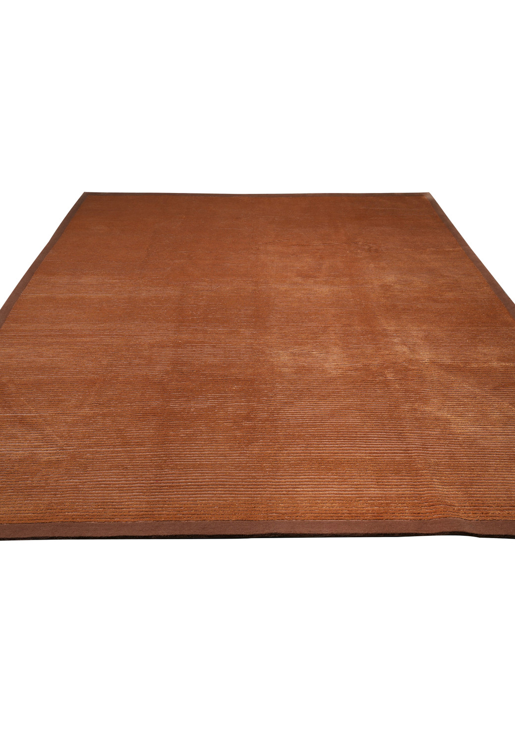 Laid-down view of a modern wool and silk Tibetan rug displaying soft surface texture, tonal depth, and elegant minimalist design