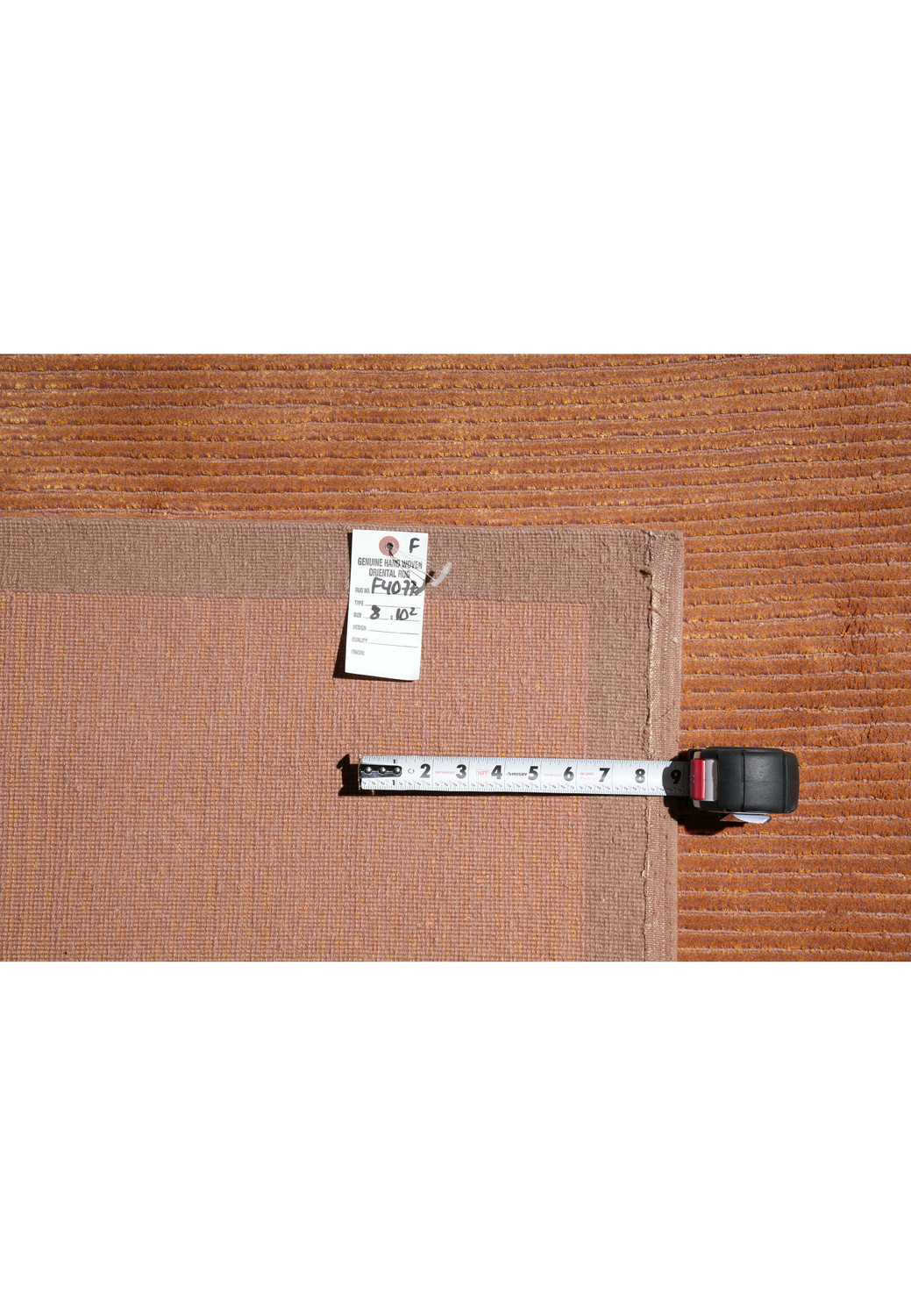 Backside view displaying the tight weave and craftsmanship of this handmade Tibetan wool and silk rug with a durable structure