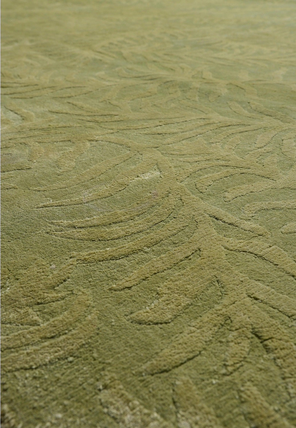 Close-up of the cotton foundation backing that supports the durable handmade construction of this modern rug.