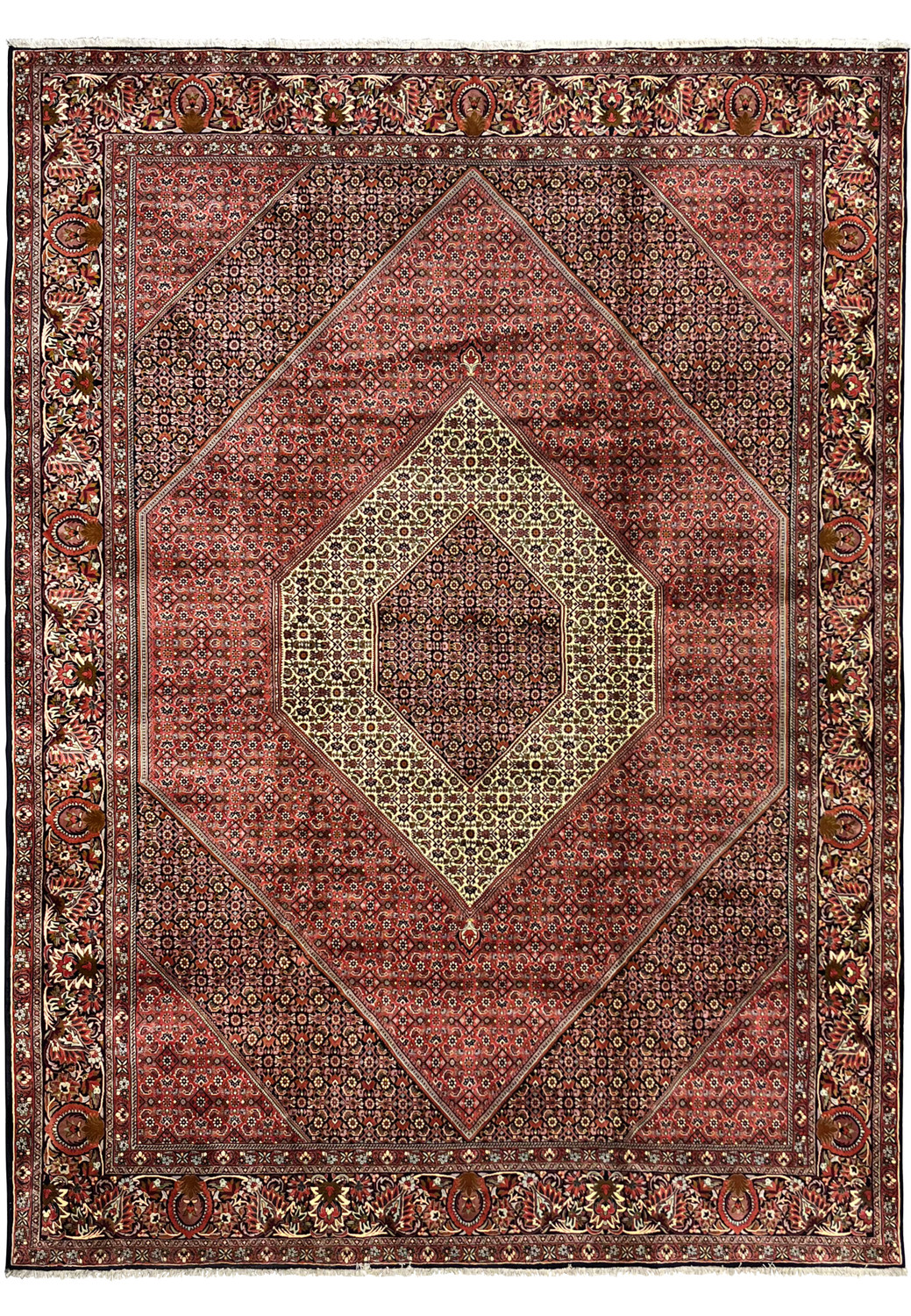Full view of large Persian Bijar iron rug with diamond medallion and bold red geometric design