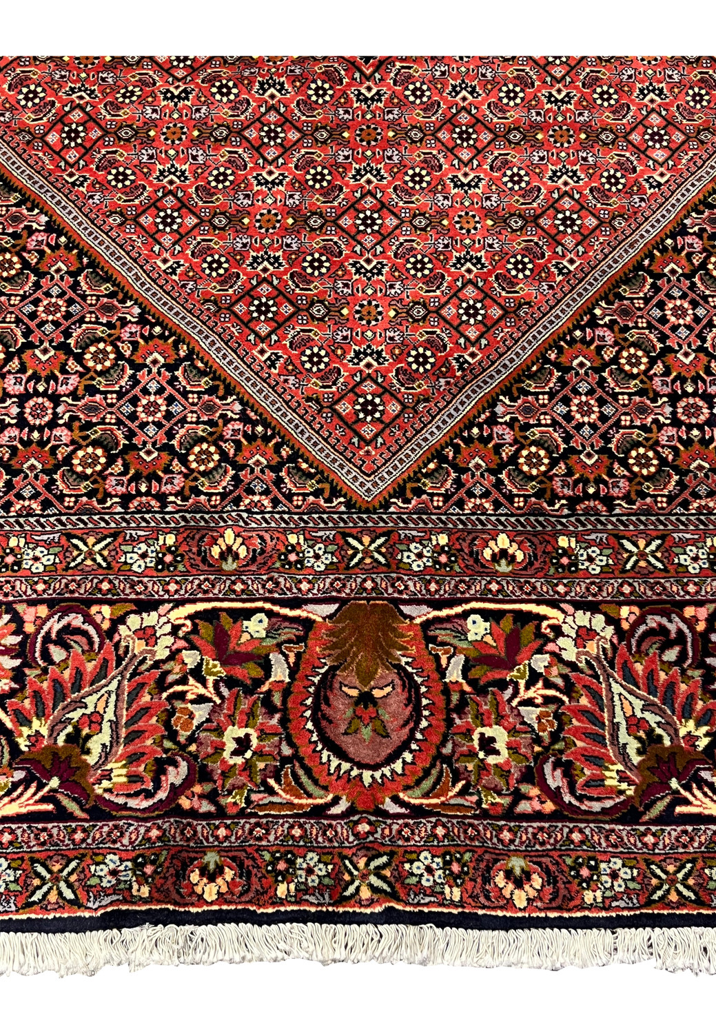 Lower border detail of Persian Bijar iron rug with dense floral patterns and strong wool pile