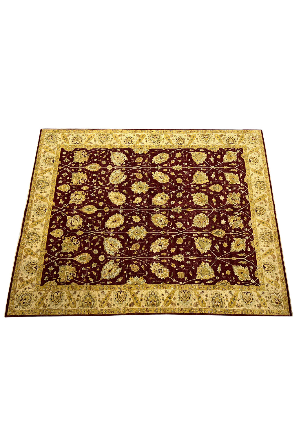Top view showing the allover floral vine pattern on a burgundy Zigler Chobi Peshawar rug