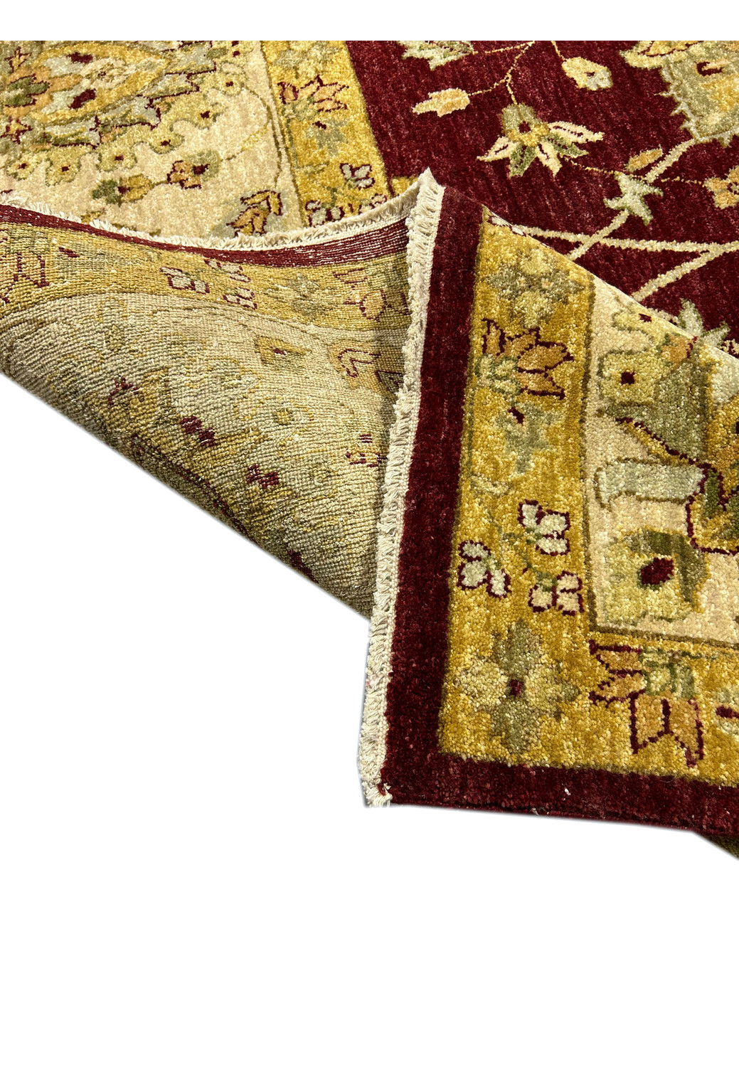 Folded corner showing pile density and border construction of a Chobi Peshawar rug