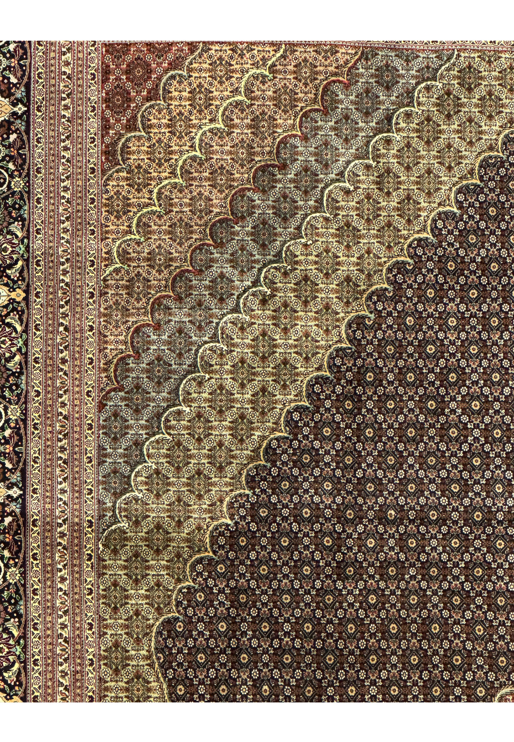Inner border close up of a Persian Tabriz Mahi 50 Raj rug highlighting repeating floral motifs and crisp line definition in muted tones