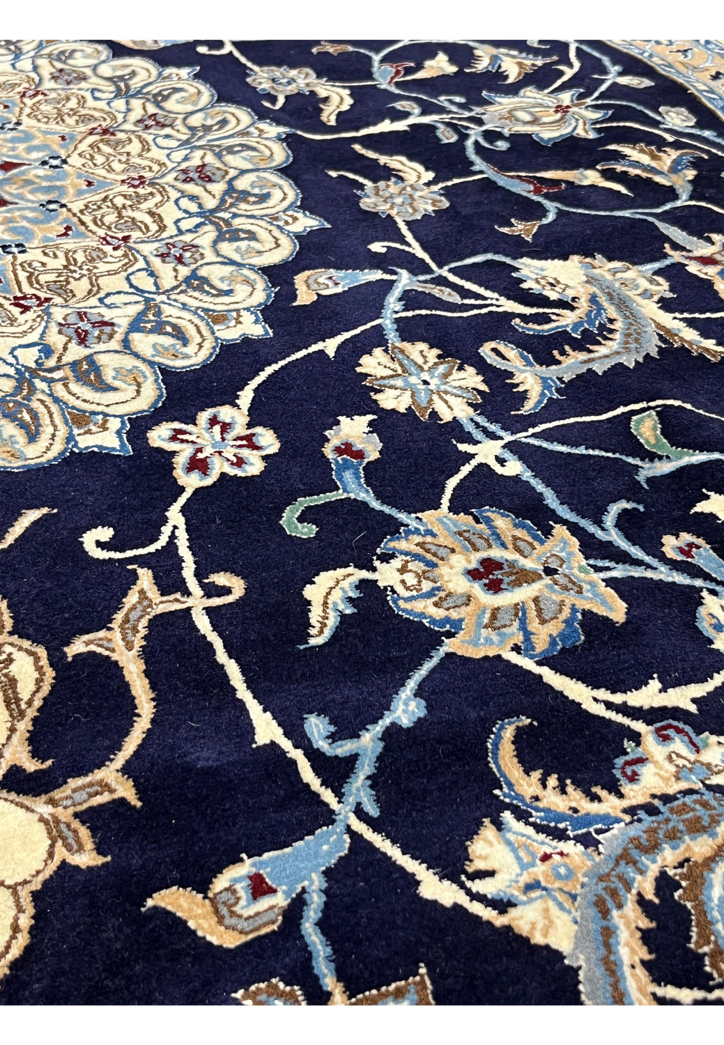 Foundation close-up of a Persian Nain 6 LA rug highlighting tight knot structure, cotton base, silk details, and refined craftsmanship from Iran