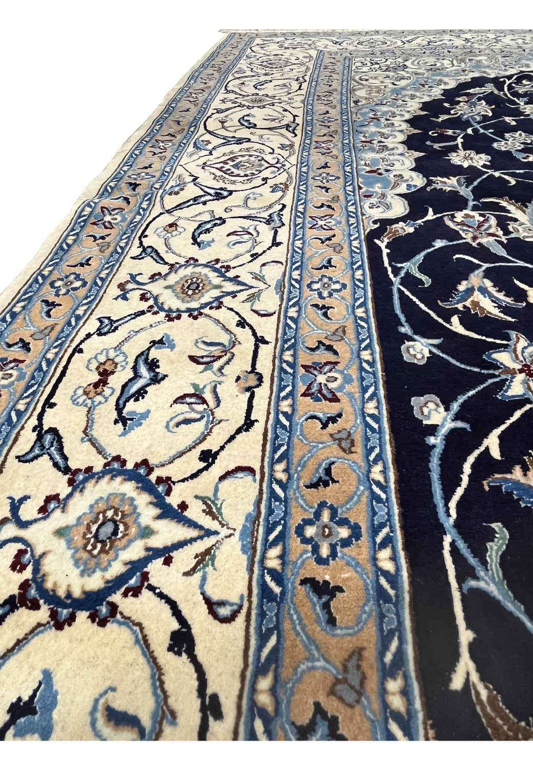 Side border close-up of a 6'5 x 10 Persian Nain 6 LA rug displaying layered ivory borders, light blue vines, and silk-defined floral outlines