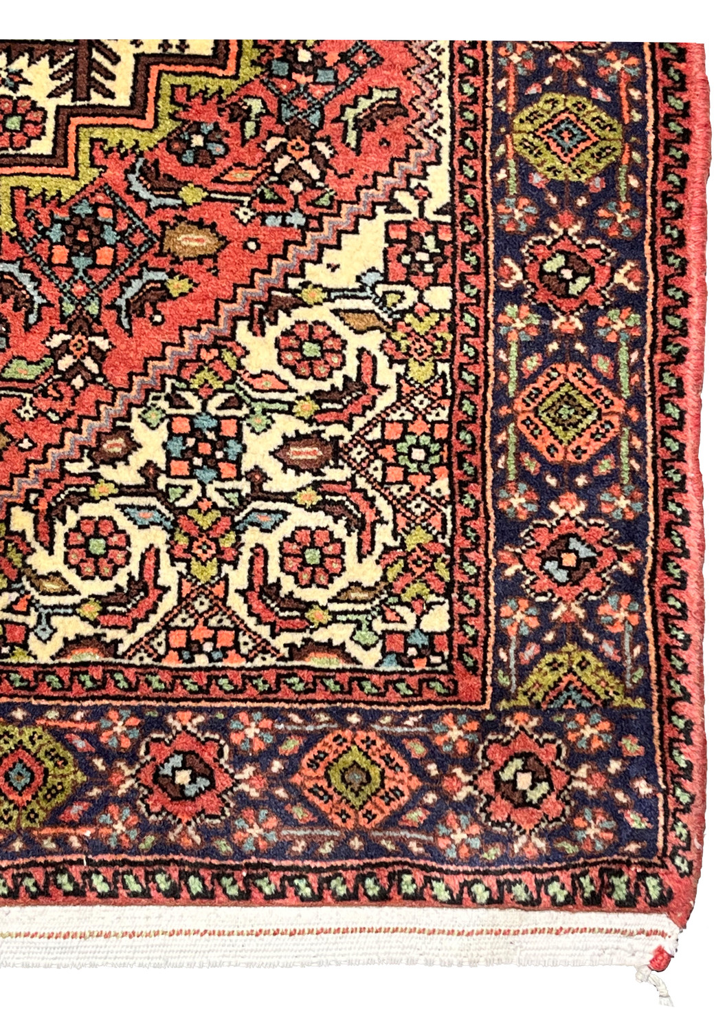 Detailed view of navy blue tribal border with diamond motifs on hand-knotted Persian Gholtogh rug