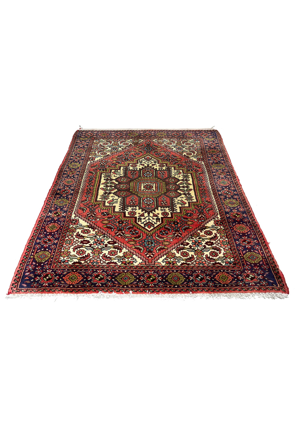 Small Persian Gholtogh tribal rug laid flat showing geometric medallion, ivory motifs, red field, and navy blue border