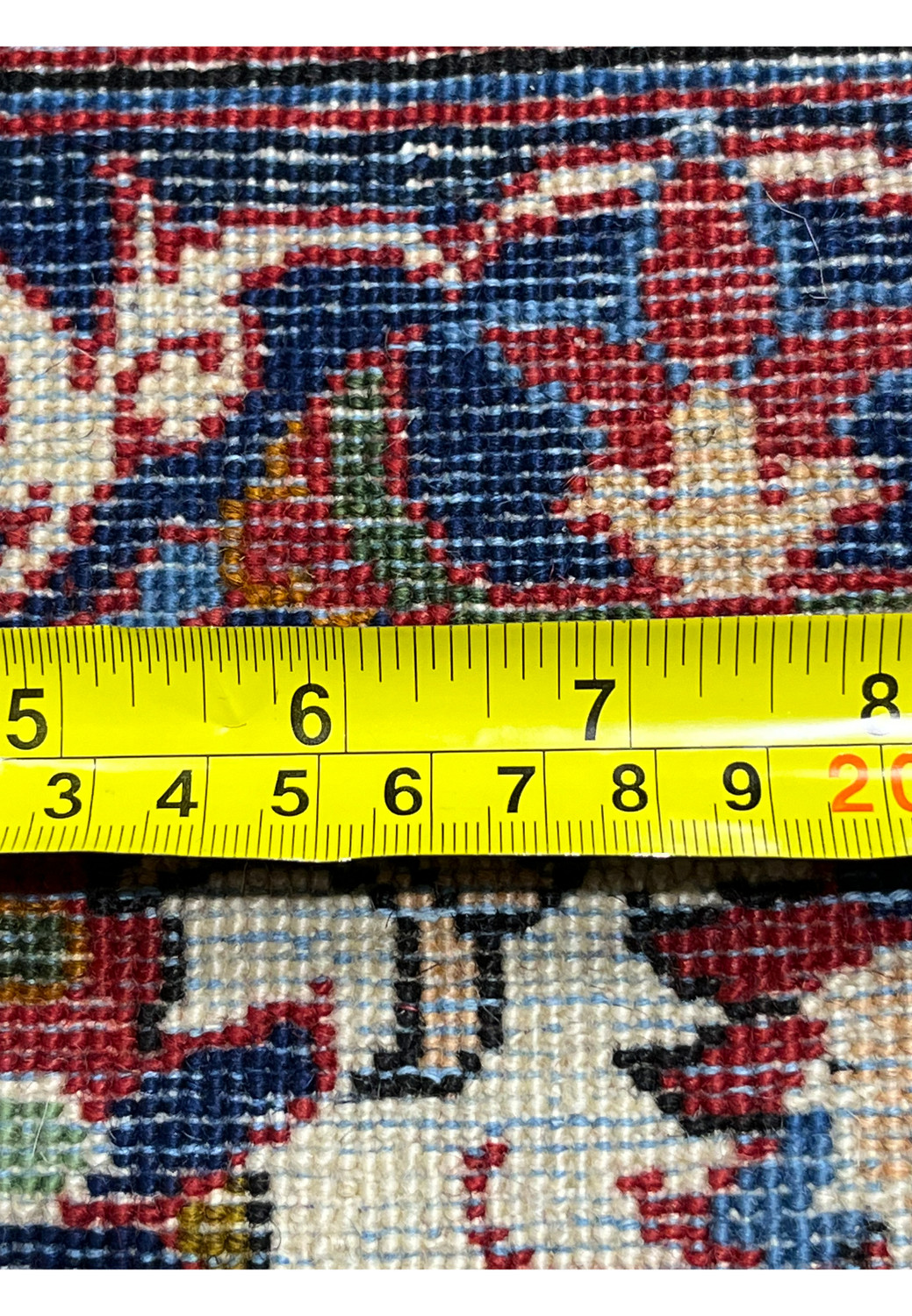 Zoomed knot detail on the backside of a Persian Isfahan rug showcasing extremely fine knot density and meticulous kork wool craftsmanship