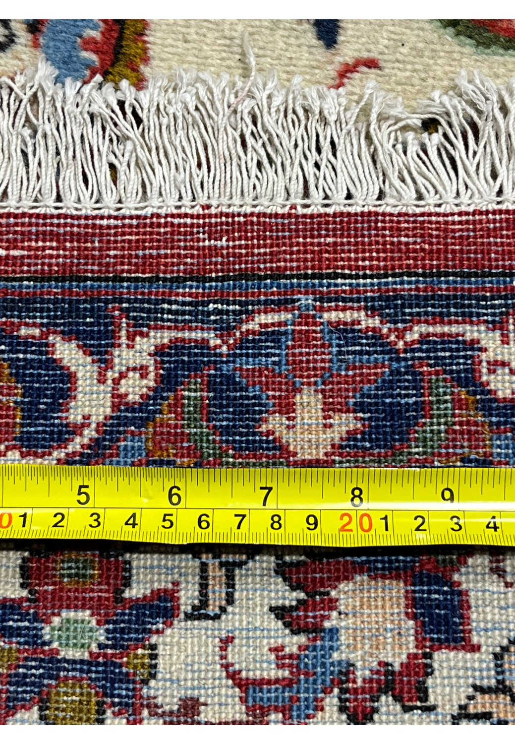 Measured backside of an Isfahan rug highlighting dense knot count, fine weaving precision, and accurate scale of the hand-knotted construction