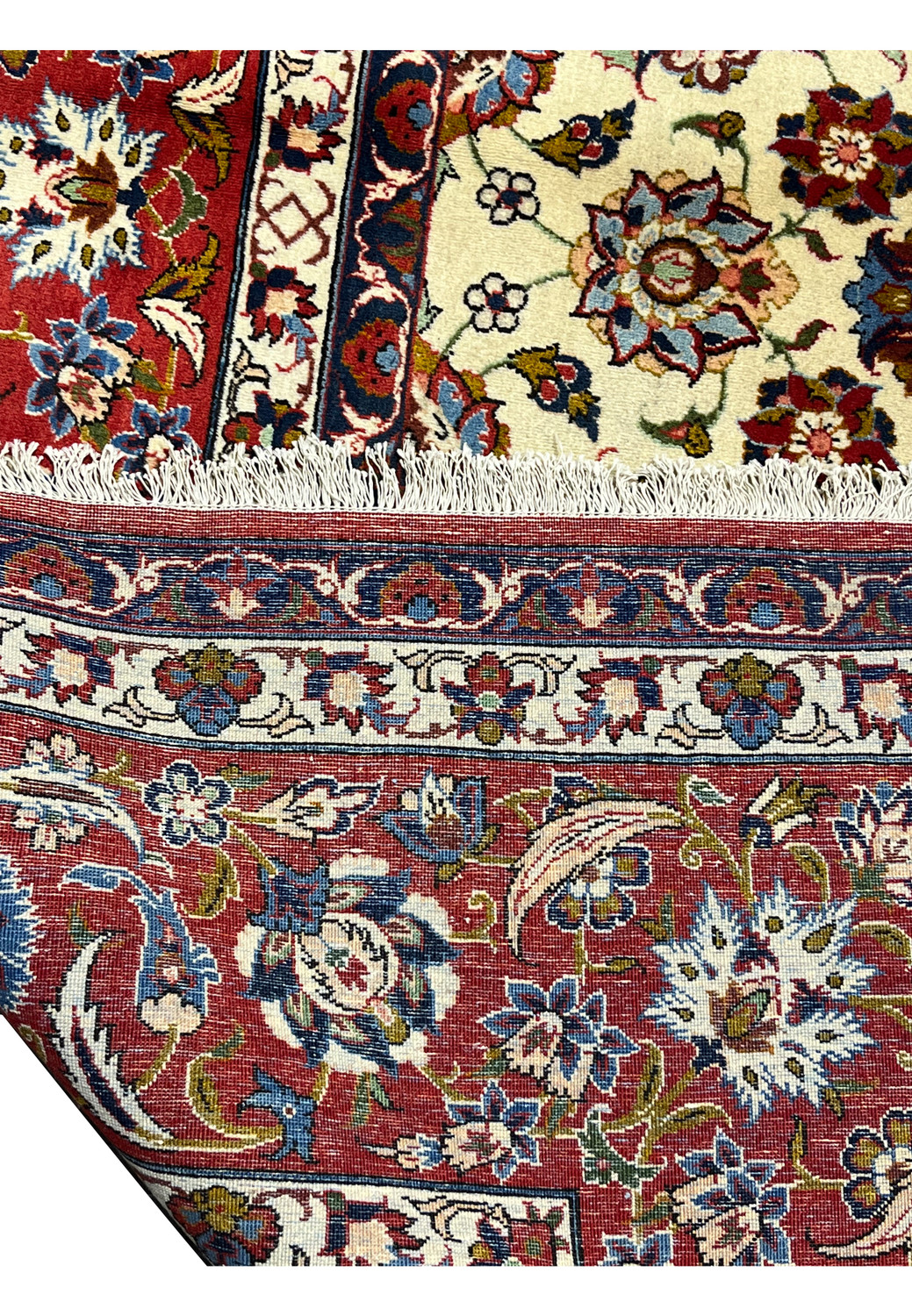 Backside view of a Persian Isfahan rug showing tight, uniform knots, clear pattern definition, and high-quality handwoven structure