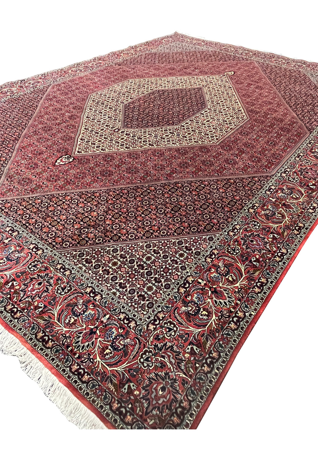 Angled view of a Persian Bijar iron rug emphasizing its firm construction, thick wool pile, geometric clarity, and strong architectural presence