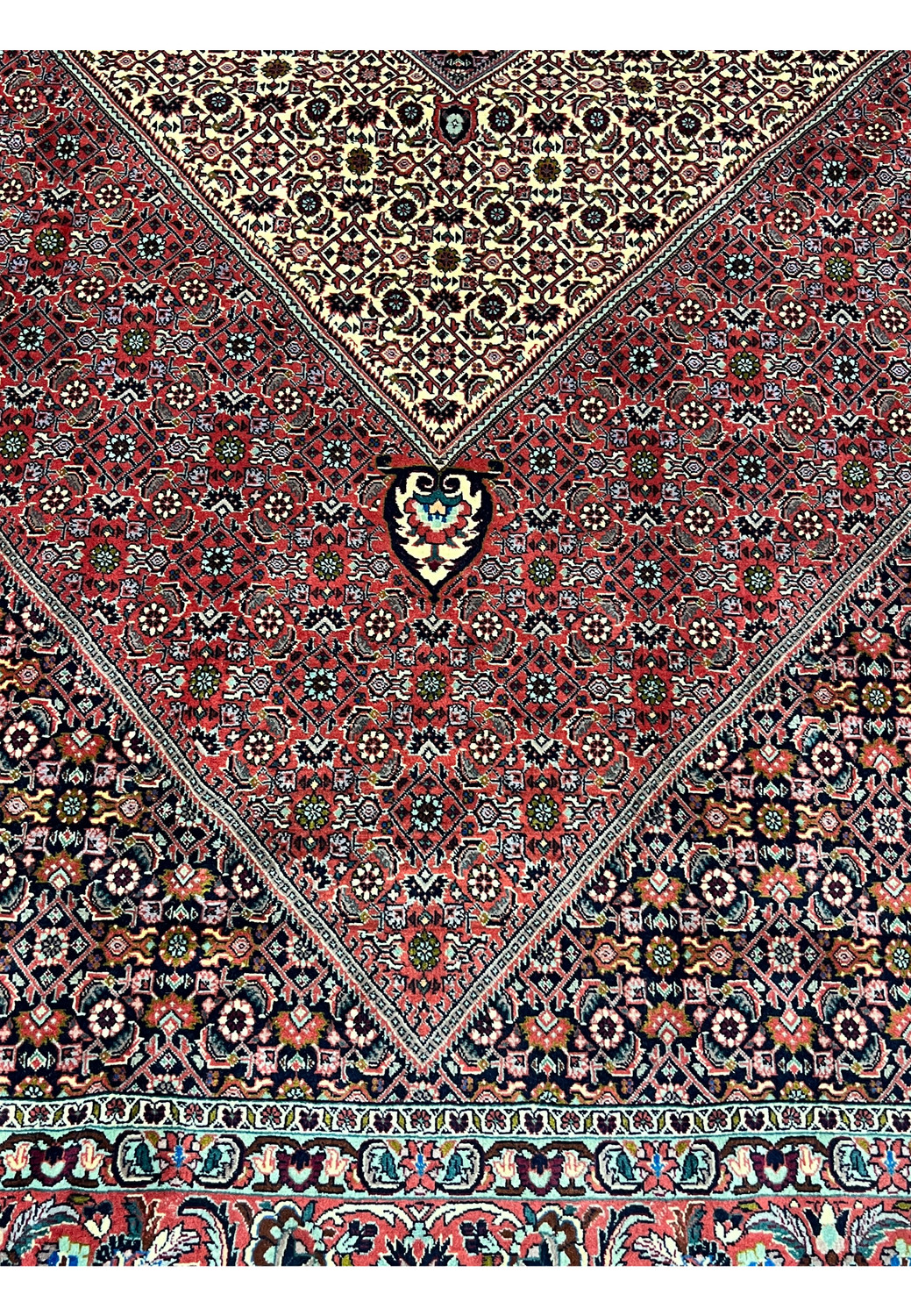 Lower section of a Persian Bijar rug displaying geometric transitions, strong wool construction, and tightly packed motifs with clear definition