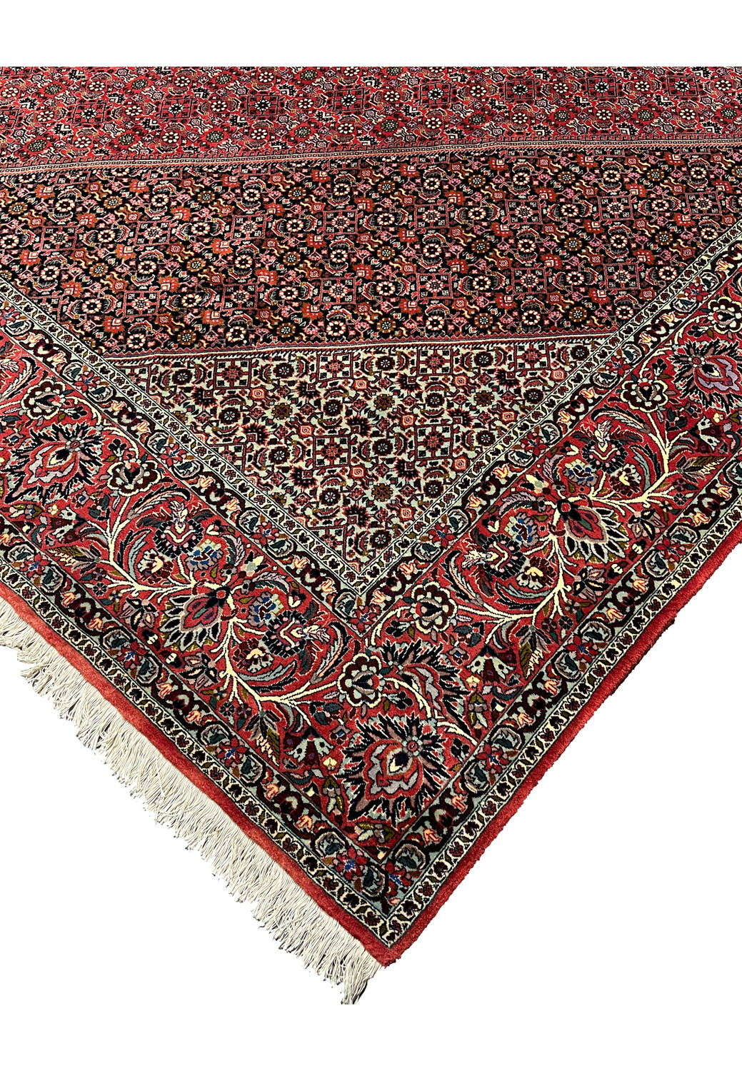 Edge detail of a Persian Bijar iron rug highlighting dense wool pile, straight selvedge, tight knotting, and exceptional structural integrity