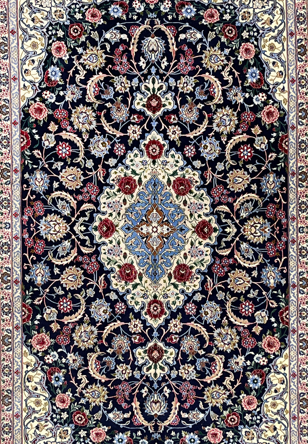 Central field of Persian Isfahan rug featuring ivory medallion, light blue arabesques, burgundy floral accents, and dense fine knot structure