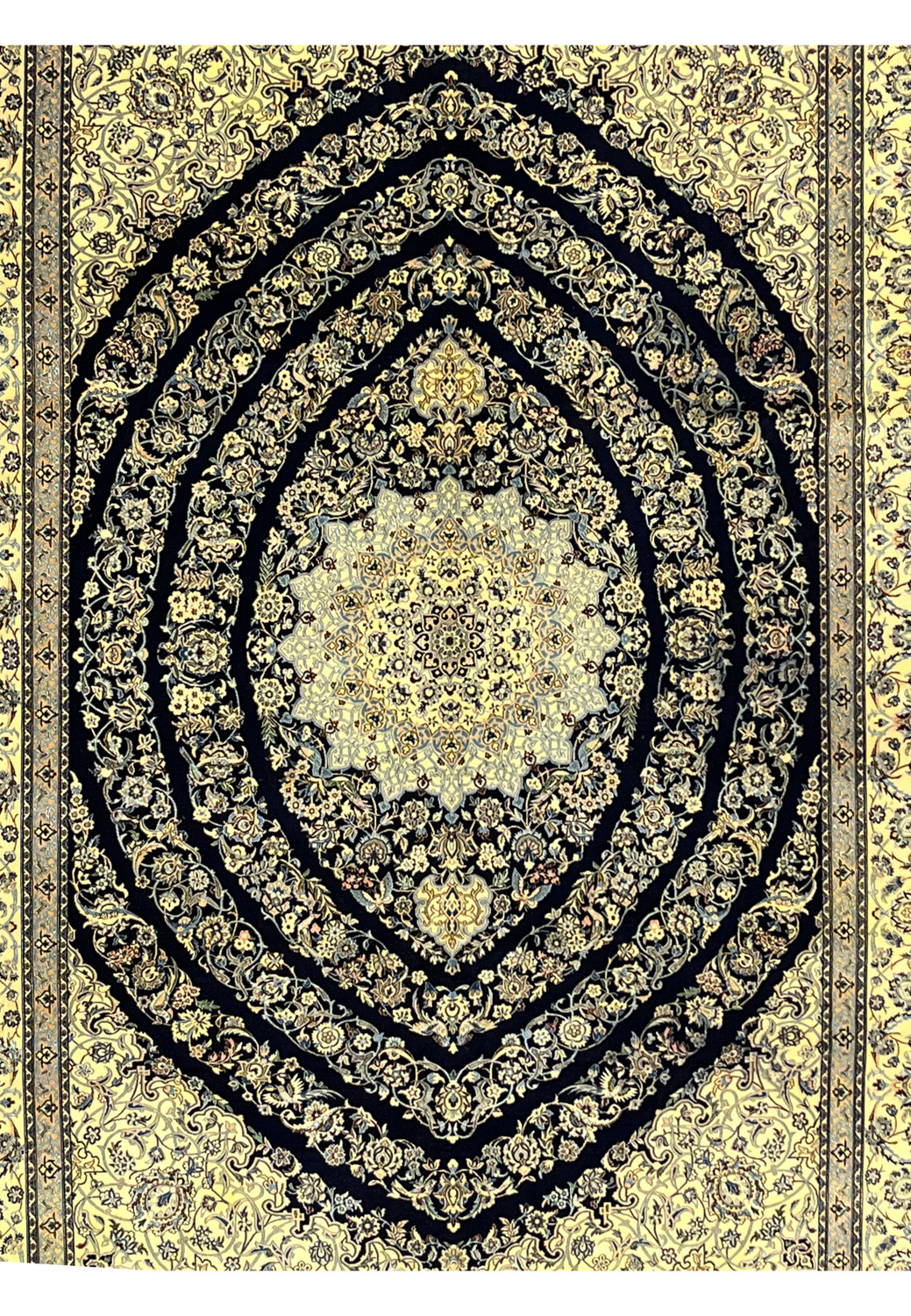 Centered view of Persian Nain 6 La rug showing layered floral medallion with light blue, ivory, and silk highlights on navy field