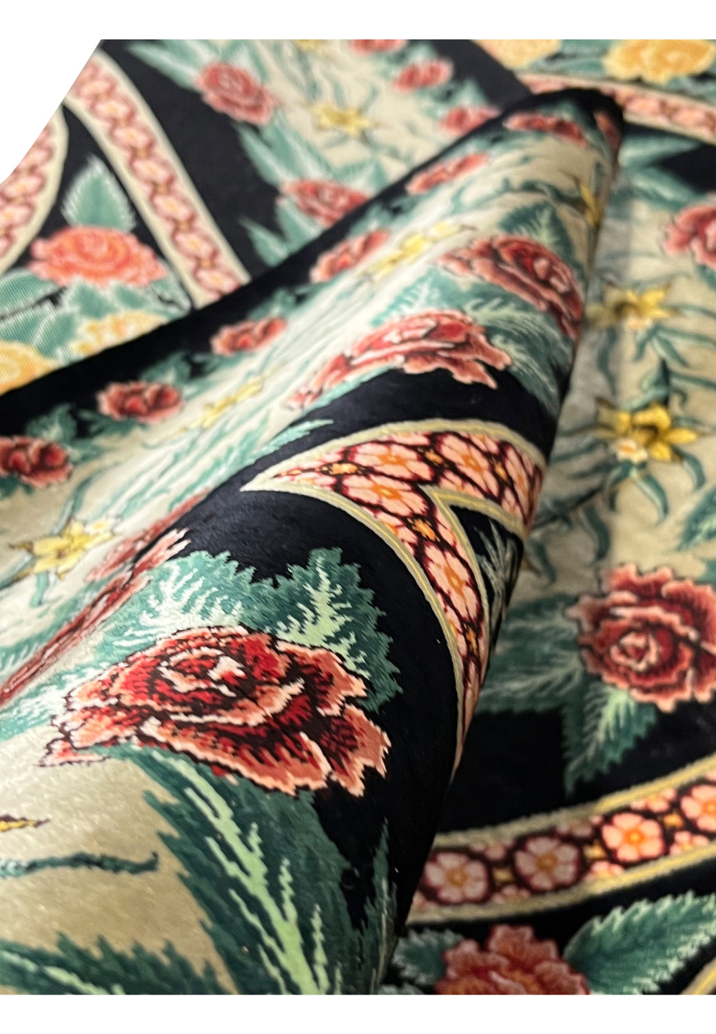 Face and foundation close-up of a Persian Qum pure silk rug showing extremely fine knot structure, uniform weave, and precise silk craftsmanship