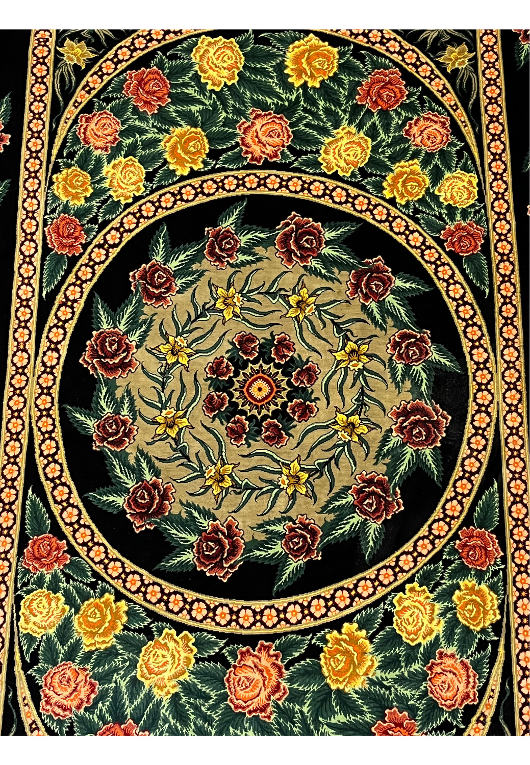 Central medallion detail of a 3'5 x 5'2 Persian Qum 100 percent silk rug featuring circular floral symmetry, fine knot density, and rich color contrast