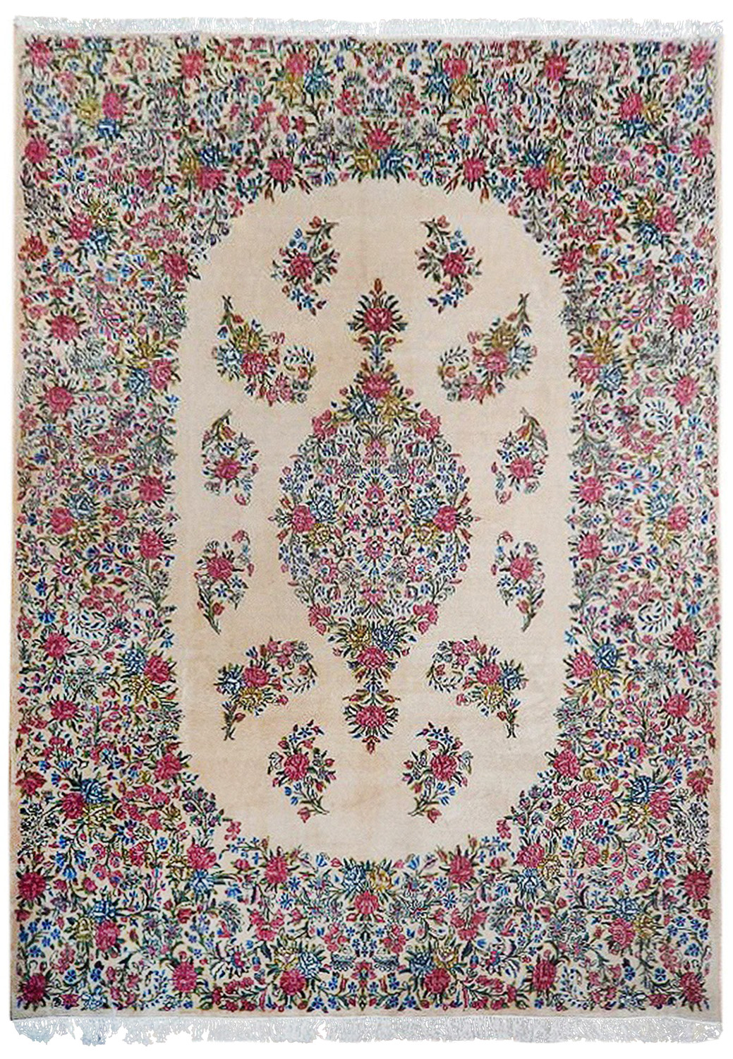 Straight-on image of a hand-knotted Persian Kerman rug featuring an ivory background, floral medallion, pastel pink flowers, and blue vine motifs