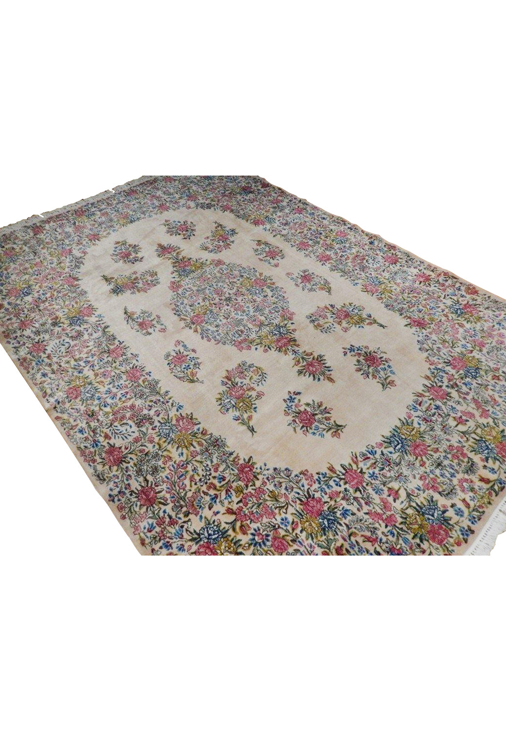 Angled perspective of a Persian Kerman floral rug highlighting the ivory field, balanced medallion layout, pastel colors, and elegant proportions