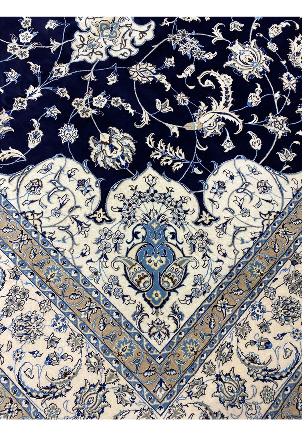 Inner border close-up of a Persian Nain 9 La oversize rug with beige ground, scrolling vines, light blue accents, and sharp detailing