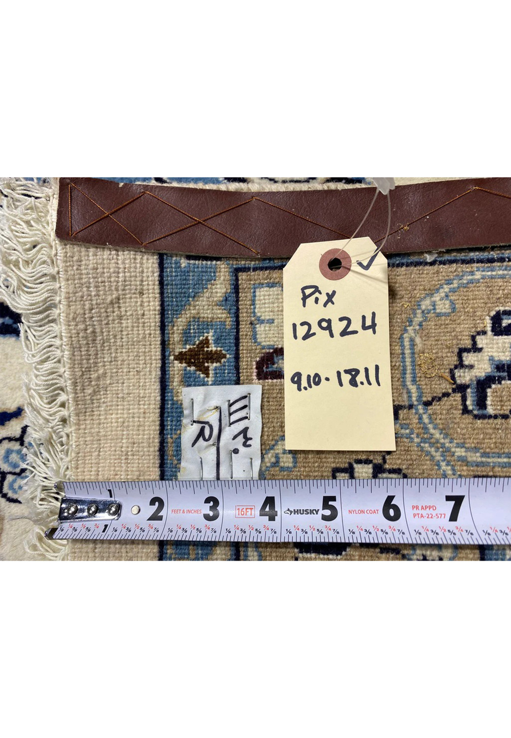 Backside view of a 10x19 Persian Nain 9 La rug revealing tight hand-knotted structure, cotton foundation, fine weave density, and craftsmanship