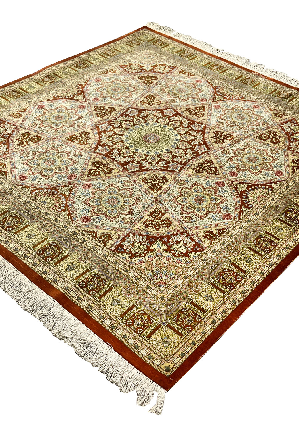 Angled view of signed Amjadi Persian Qum 5 x 5 silk rug displaying sheen variation, star medallion depth, and refined color transitions