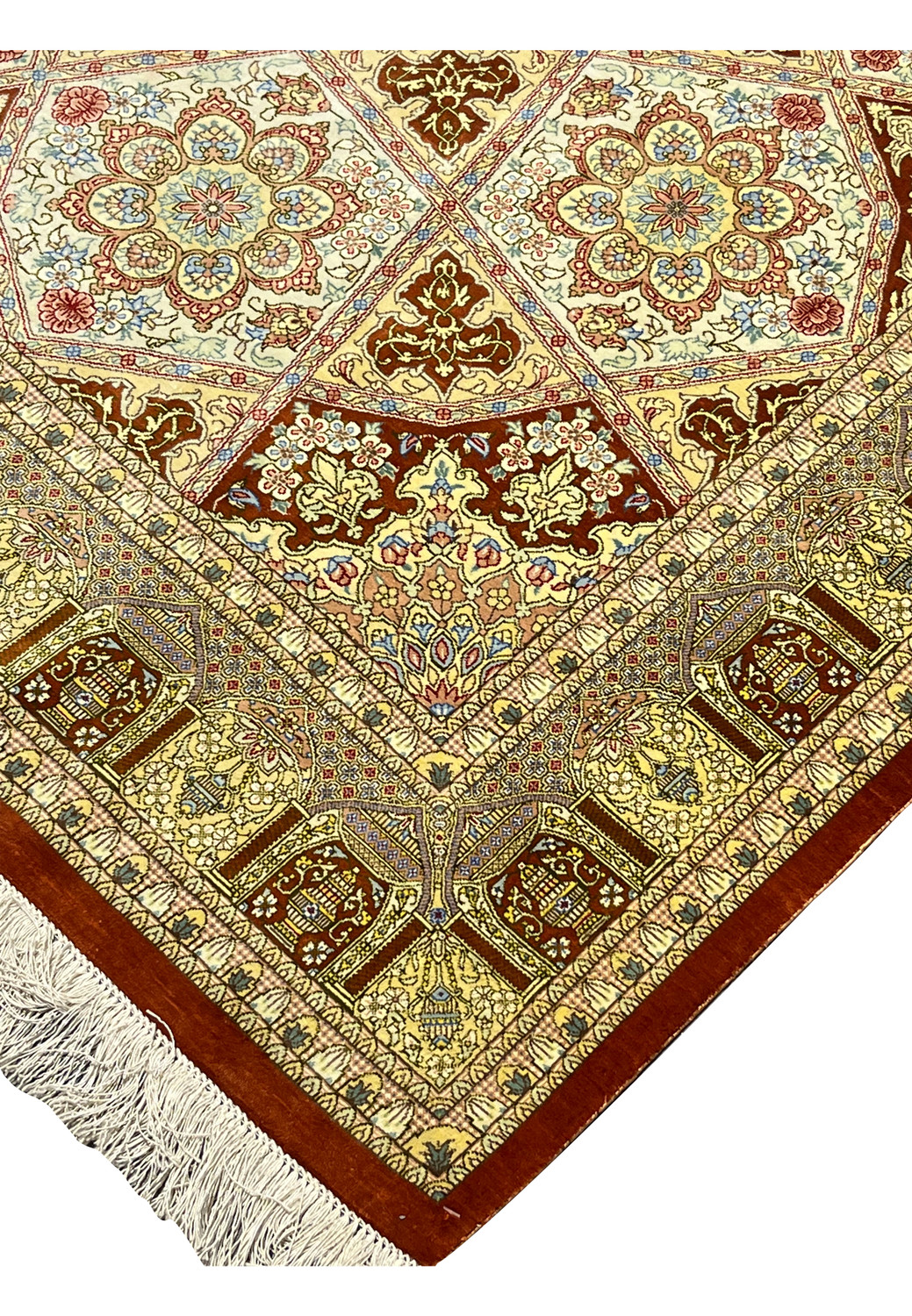 Edge detail of signed Amjadi Persian Qum silk rug showing clean binding, fine knot density, and well-preserved silk fringe