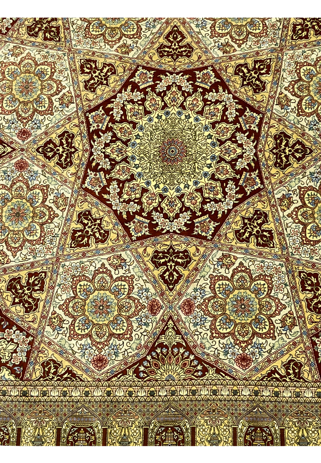 Lower section of signed Amjadi Persian Qum silk rug showing border alignment, floral motifs, and fine silk weaving clarity