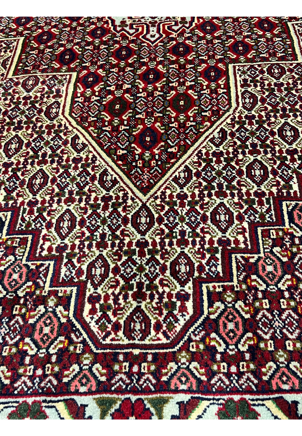Face and foundation close-up of Persian Senneh rug revealing tight knot structure, clean weaving, precise color changes, and durable wool build