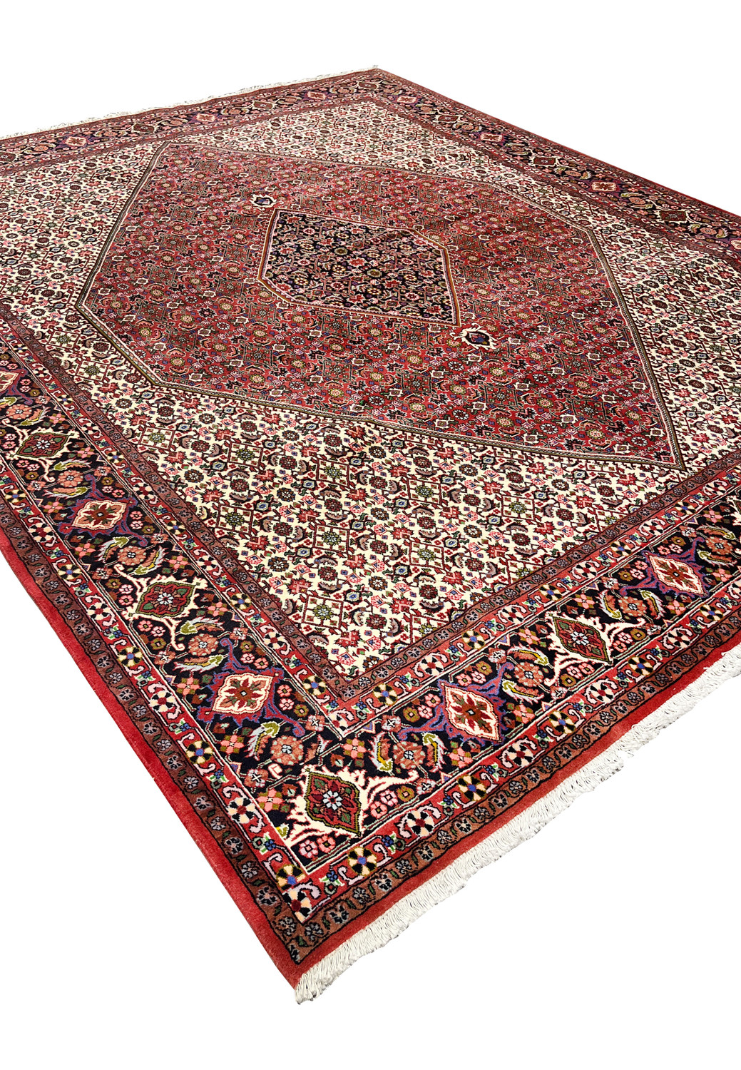 Angled perspective of 8x10 Persian Bijar rug emphasizing heavy structure, dense weave, bold medallion geometry, and rich color contrast