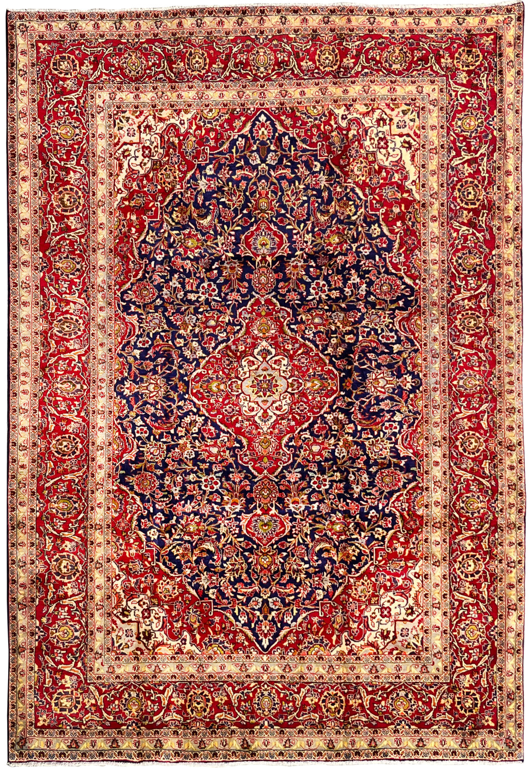 Full view of a fine 8x12 Persian Isfahan rug with deep navy blue field, ornate brick red medallion, ivory borders, and dense floral vine design