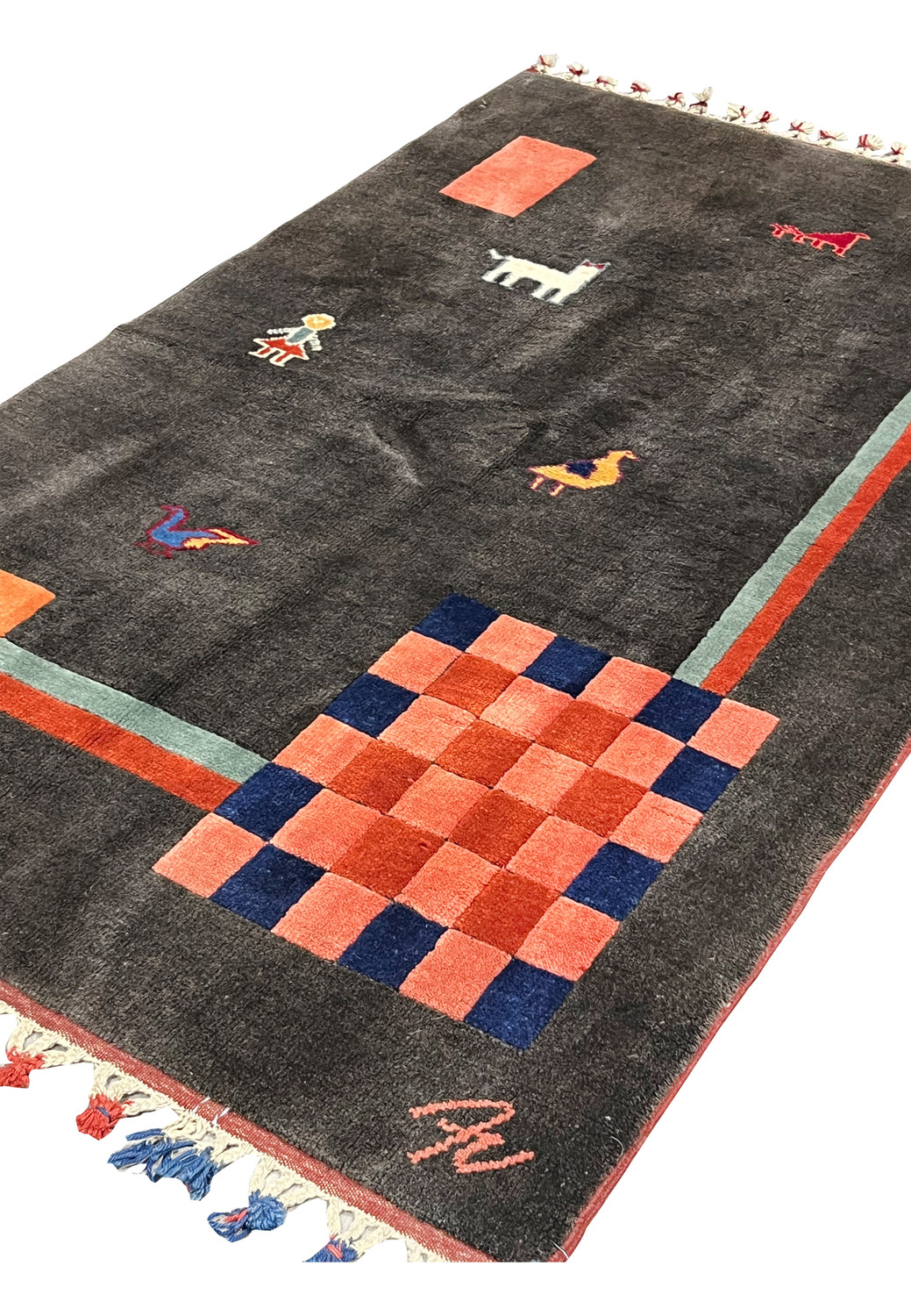 Angled perspective of Gabbeh tribal rug highlighting depth, soft pile height, checkerboard pattern, and geometric coral and navy accents