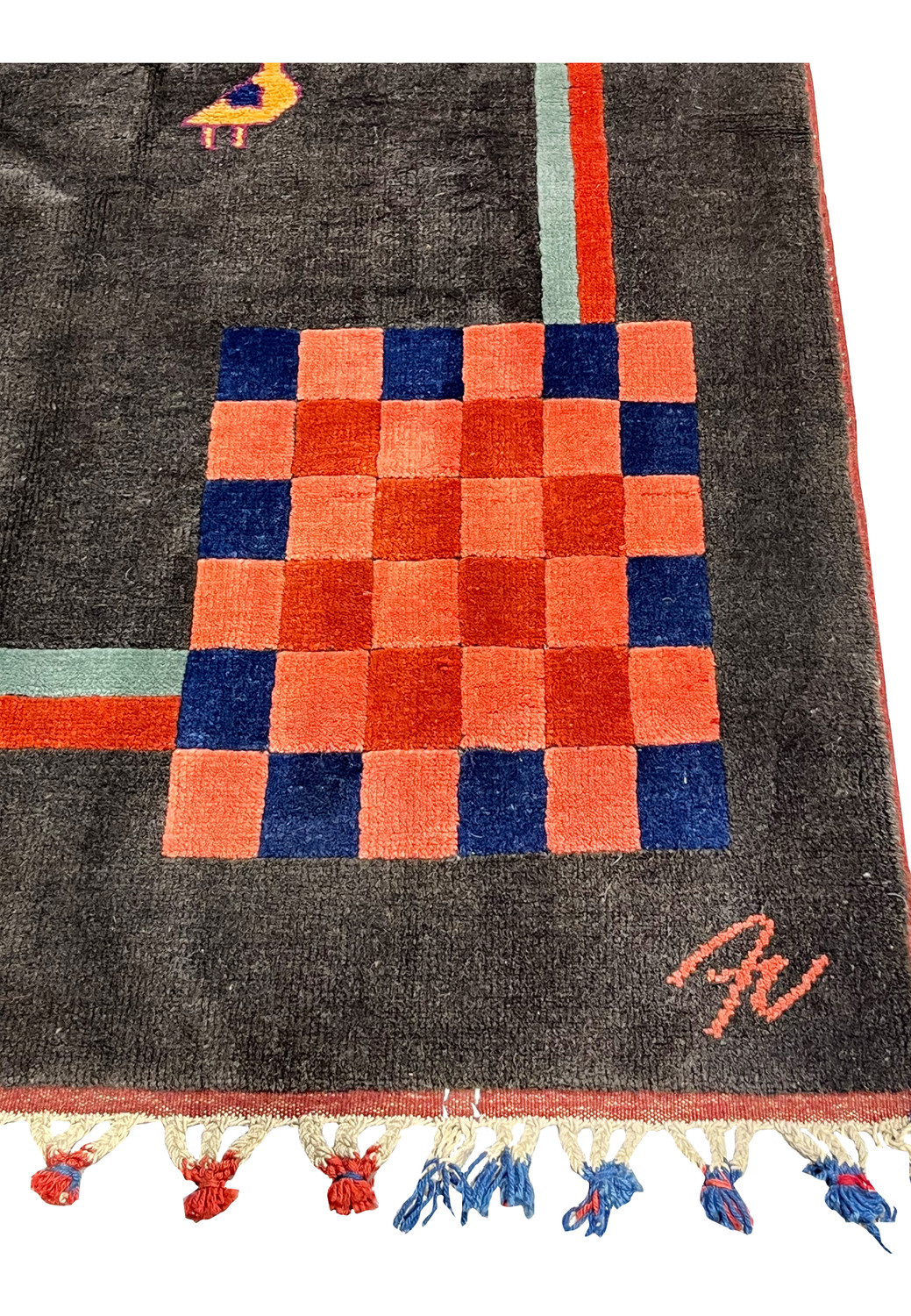 Close border detail of Gabbeh rug showing simple linear bands in coral orange and sage green with dense wool texture