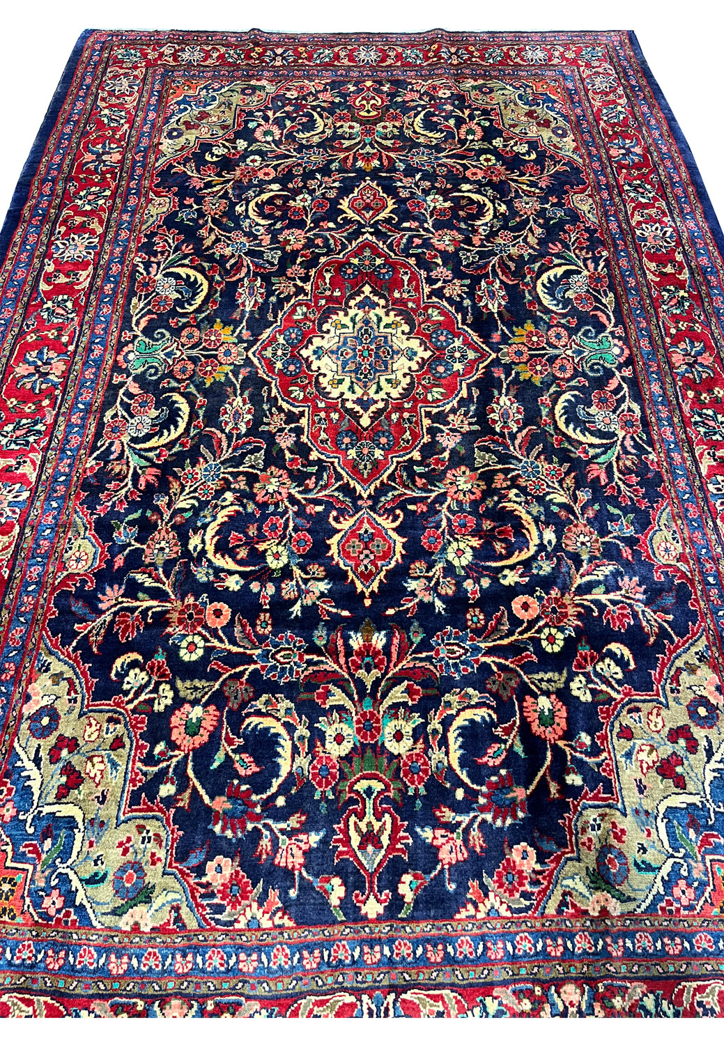 Close view of navy field Persian Mahal rug with scrolling vines palmettes flowers and ivory outlined floral motifs