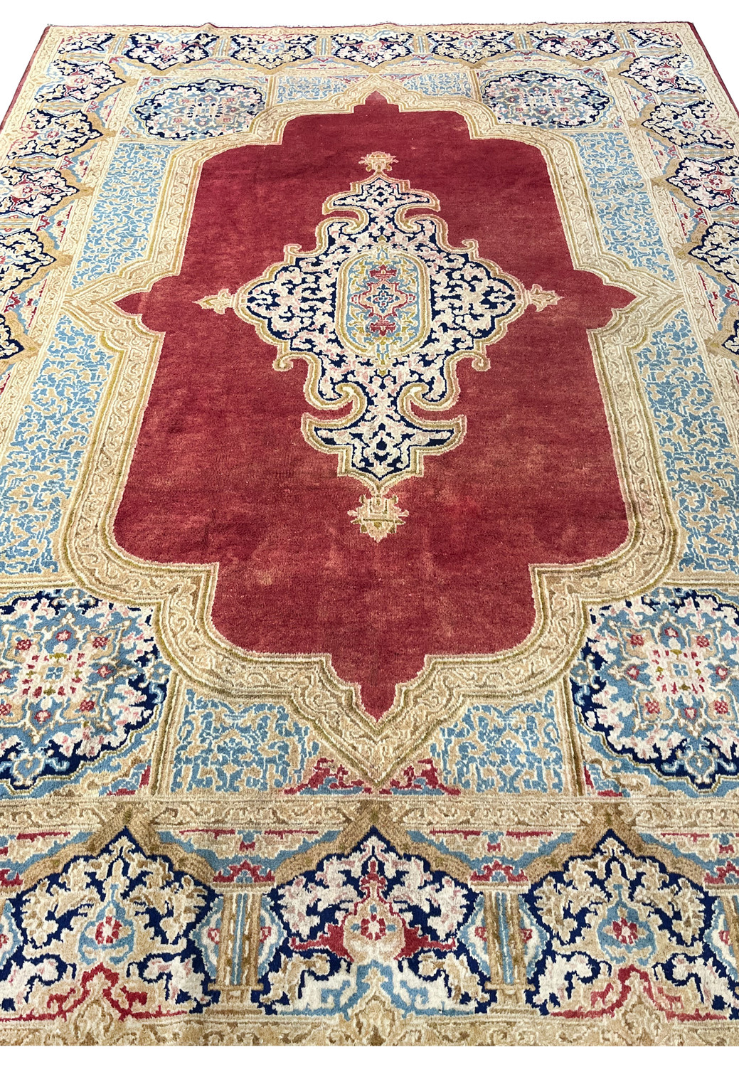 Top view antique Kerman carpet showing full border layout floral panels sky blue compartments ivory frame hand knotted wool