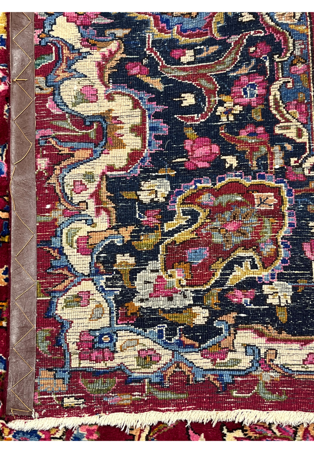 Backside view of hand knotted Persian Mashad rug showing tight knot structure, even weaving, and clear pattern visibility from reverse.