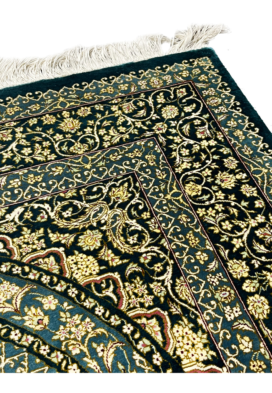 Top edge with silk fringe and floral border detail, showing clean foundation and fine craftsmanship