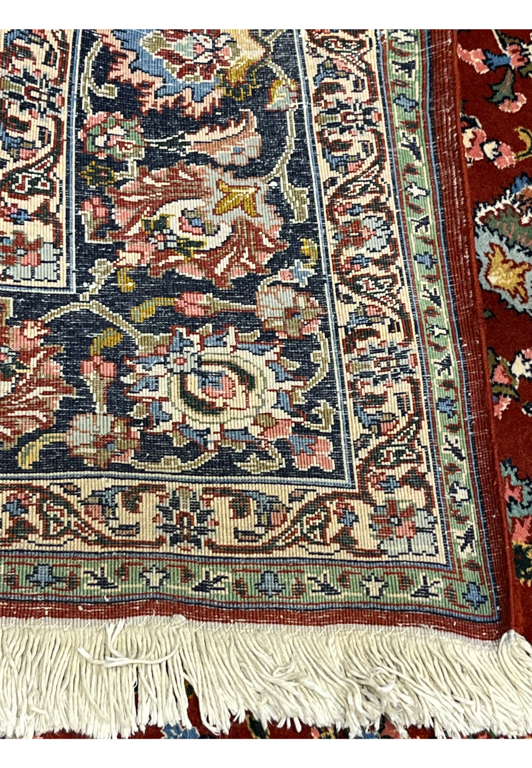 Backside of Persian Tabriz rug highlighting fine knot density, precise pattern clarity, cotton foundation and artisan hand knotted craftsmanship