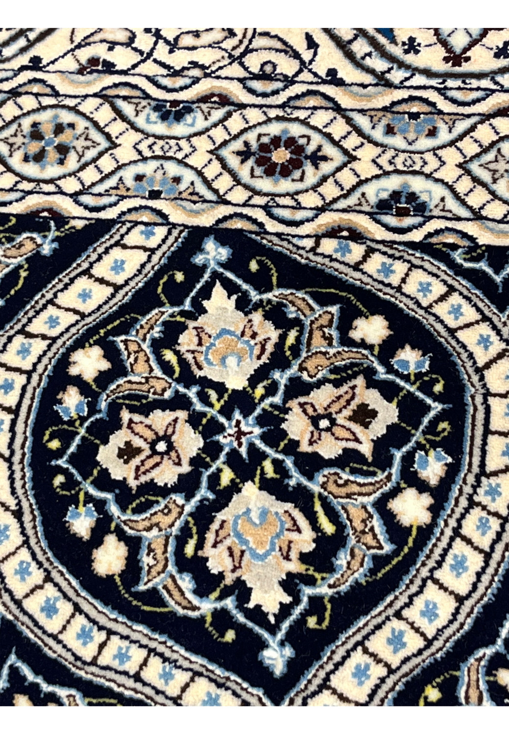 Allover navy dome pattern on Persian Nain Habibian 6 LA rug with ivory lattice and silk floral highlights.