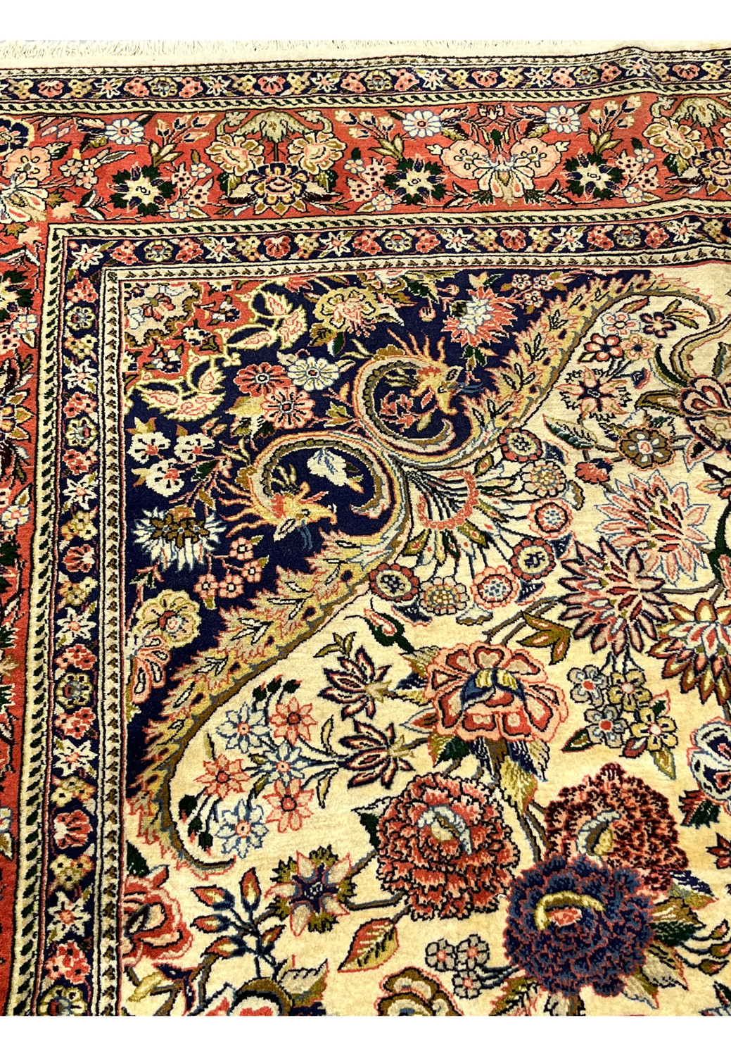 Inner navy border detail on Persian Bijar rug with repeating floral motifs ivory outlines and fine precision